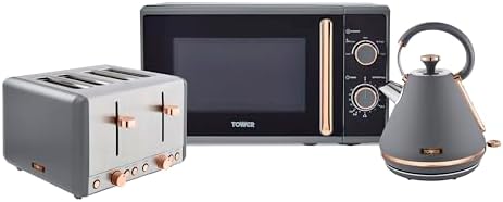 A coordinated Tower Cavaletto kitchen appliance set featuring a matte grey and rose gold kettle, toaster, and microwave on a modern kitchen counter.
