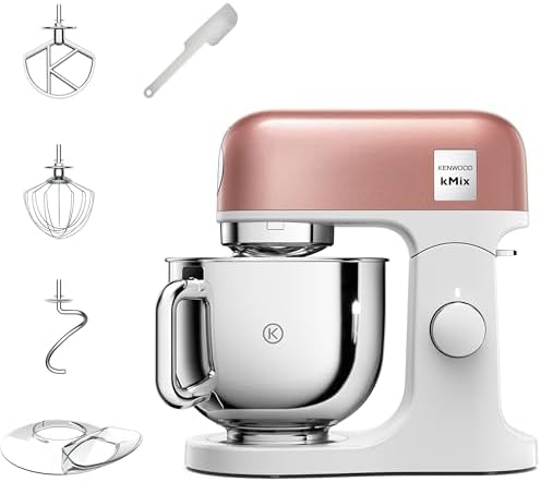A side-profile view of the Kenwood kMix KMX760API in Apricot Pink showing the metal housing and the 5-litre stainless steel bowl.