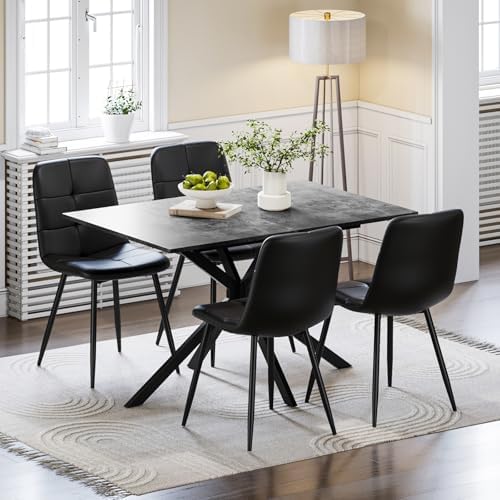 A modern extendable dining table with a grey concrete effect top and a black central pedestal base.