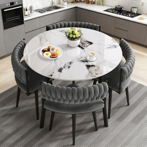 Modern white 5-piece dining set with four chairs tucked neatly under a 90cm circular table to save space.