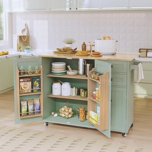 Green kitchen island with drop leaf tabletop and drawers.